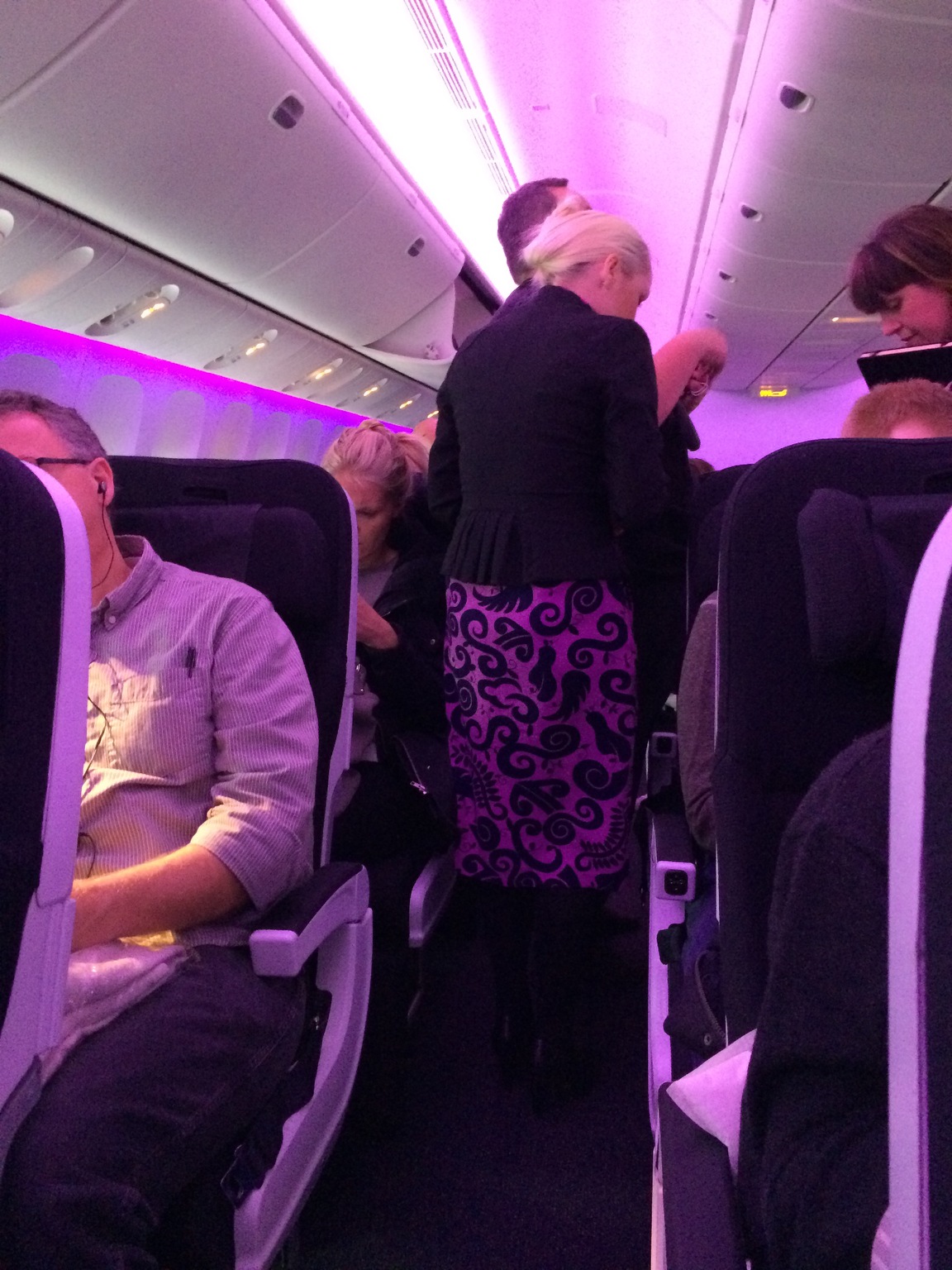 Purple Flight Attendants on Air New Zealand Flight NZ2